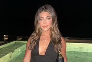 Gia Giudice sitting in front of a pool.