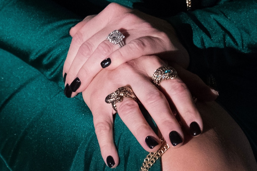 A close-up of Margaret Josephs' jewelry on her hands.