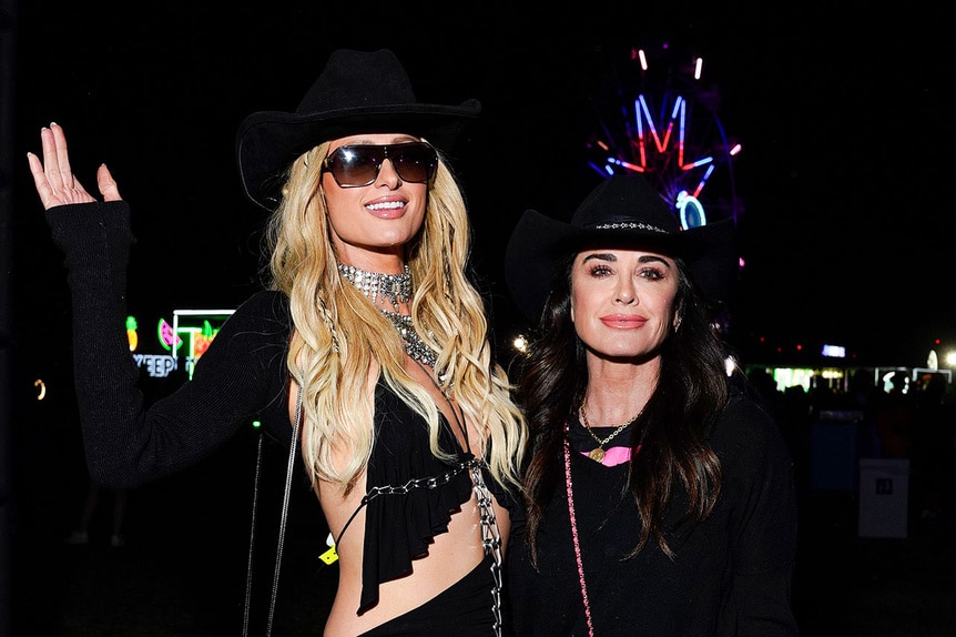 Paris Hilton and Kyle Richards attend Neon Carnival at Coachella.
