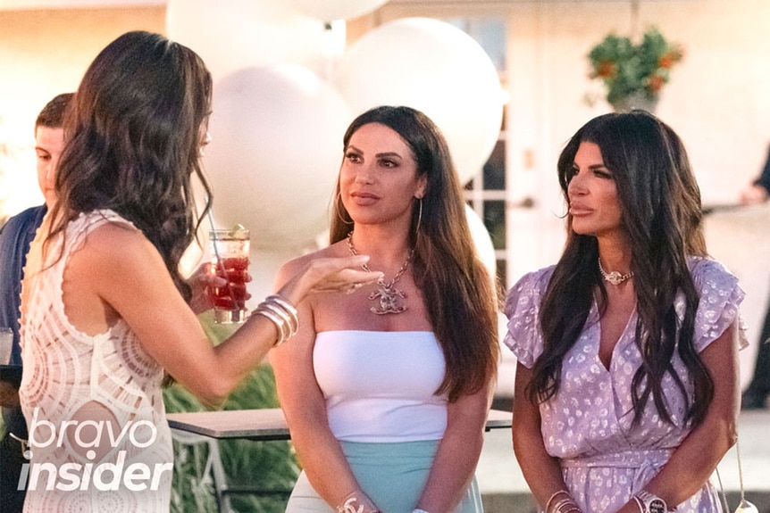 Jennifer Aydin and Teresa Giudice in a conversation at a party together