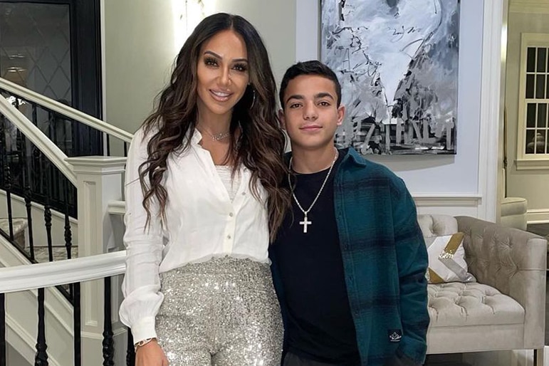 Melissa Gorga and Gino Gorga standing in their living room together in New Jersey.