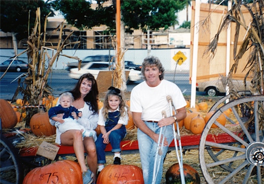 Lisa Vanderpump sitting with Ken Todd and their two kids at a pumpkin patch.