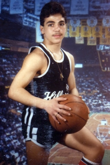 Joe Gorga holding a basketball in his team uniform.