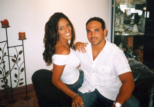 Melissa and Joe Gorga wearing jeans and white tops.