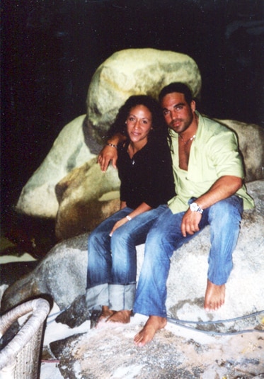 Melissa Gorga and Joe Gorga sitting on a rock formation together