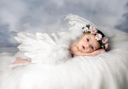 Baby Gia Giudice posing in a flower clown and angel wings.