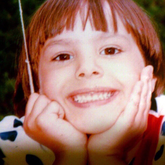 Kristen Doute smiles as a young girl.