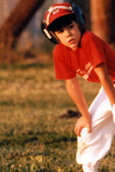 A young Tom Sandoval wears a baseball uniform.