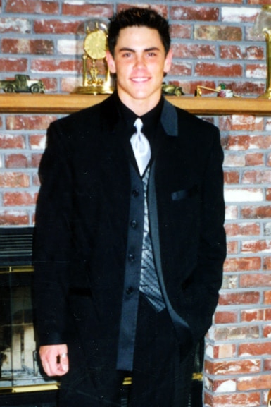 Tom Sandoval wears a suit and tie as a teen before a school dance.