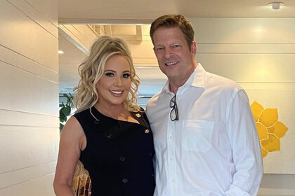 Shannon Storms Beador wearing a black dress and John Janssen wearing a white shirt at Shannon's home.