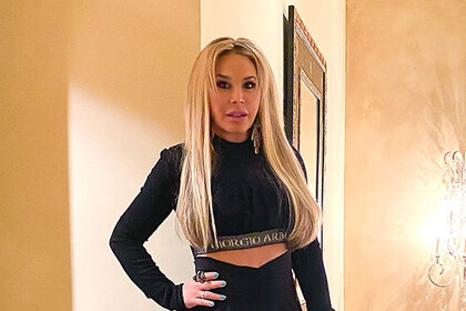 An Instagram photo of Adrienne Maloof standing in her home with her hand on her hip
