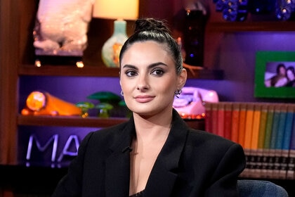Paige Desorbo in a black blazer wearing a top bun and full glam at Watch What Happens Live.