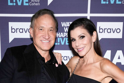 Heather Dubrow and Terry Dubrow pose together at Watch What Happens Live