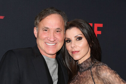 Heather Dubrow and Terry Dubrow pose for a photo together.