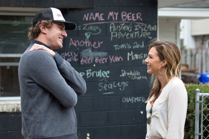 Shep Rose and Chelsea Meissner having a conversation at a beer garden in Charleston, South Carolina.