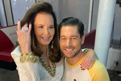 Craig Conover and Patricia Altschul posing and smiling together.