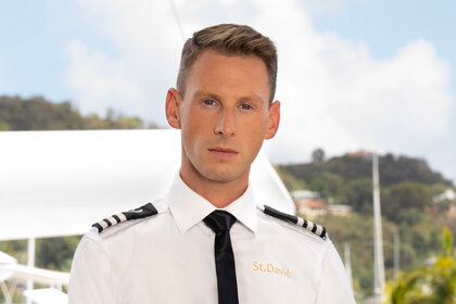 Fraser Olender of Below Deck Season 11 wearing his yachting uniform.