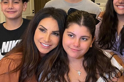 Jennifer Aydin with her arms around her daughter Olivia Aydin.