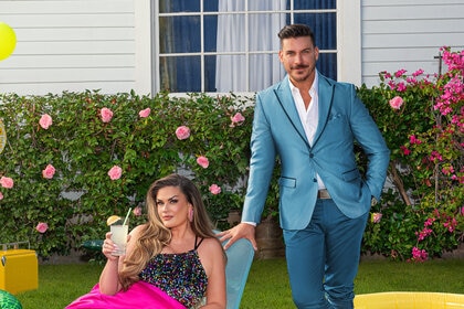 Brittany Cartwright and Jax Taylor on a grass lawn together