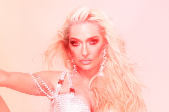 Erika Jayne wearing a bedazzled onsie with pink and yellow color treatment over her.