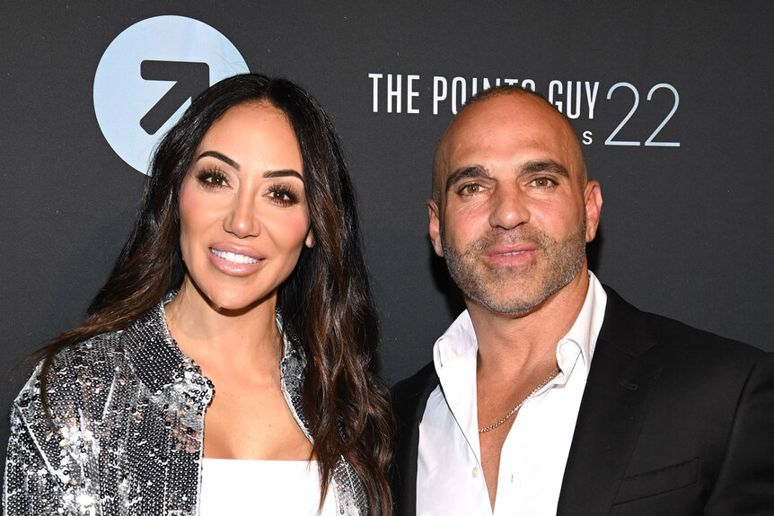 Melissa Gorga and Joe Gorga in front of a step and repeat at an event.