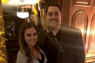 Lauren Manzo and Vito Scalia smiling at a party together.