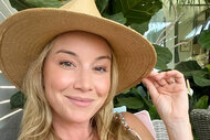 Headshot of Hannah Ferrier wearing a straw hat.