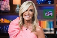 Tinsley Mortimer smiling and sitting in a pink, one shoulder, dress at the WWHL clubhouse in New York City.