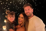Scheana Shay, Brock Davies, and Summer Moon posing together in front of lanterns floating into the sky in Las Vegas.