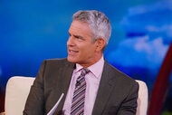 Andy Cohen sitting at the Real Housewives of Salt Lake City reunion.