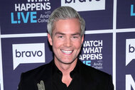 Ryan Serhant in front of the Watch What Happens Live step and repeat.