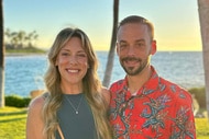 Briana Culberson and Ryan Culberson smiling next to each other in front of a coastline.