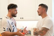 Brock Davies and Jax Taylor in a conversation together at a party at Jax's house