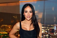Melissa Gorga smiling on a rooftop.
