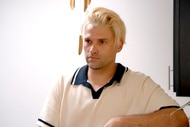Tom Schwartz with blonde hair wearing a collared shirt