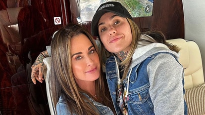 Kyle Richards and Morgan Wade sitting together on a jet.