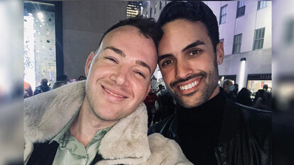 Kyle Viljoen and his husband Zachary Riley smiling together in New York City.