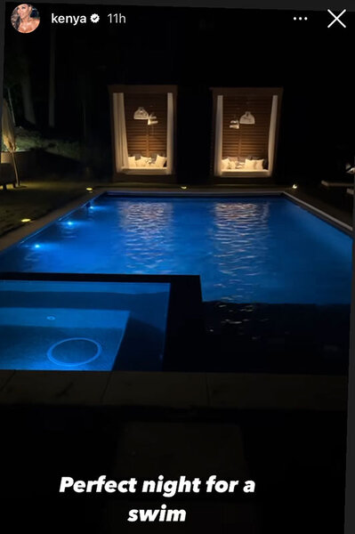 Kenya's pool lit up at night.