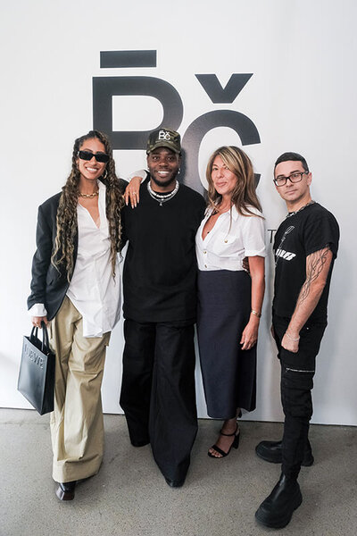 Elaine Welteroth, Bishme Cromartie, Nina Garcia, and Christian Siriano pose together in front of a white wall at Spring Studios in New York City.