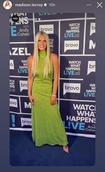 Madison LeCroy smiling in a green, metallic, tunic dress with long, straight, platinum blonde, hair at WWHL in New York City.