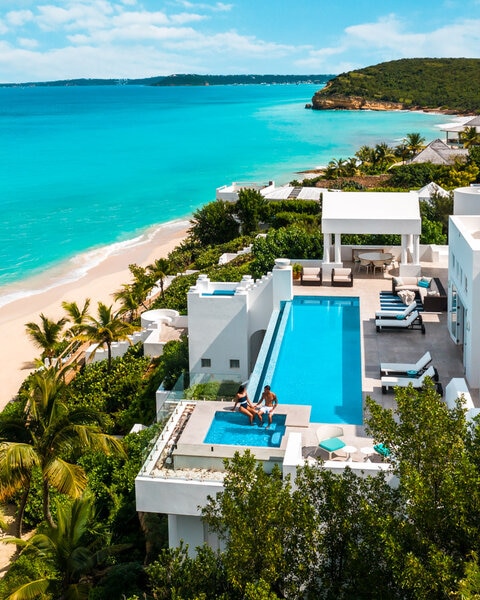Exterior view of villa on the ocean with an infinity pool in Anguilla.