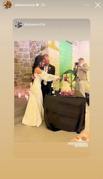 Chelsea DeMonaco and Albie Manzo cutting a cake at their wedding.