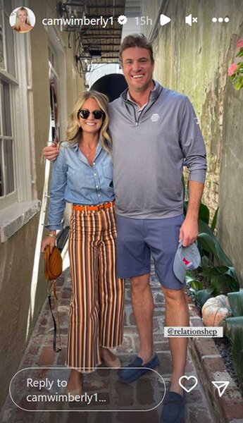 Cameran Wimberly in striped trousers embraces Shep Rose in an alleyway.