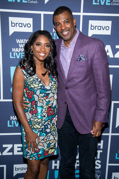 Cecil Whitmore and Simone Whitmore in front of the WWHL step and repeat together.