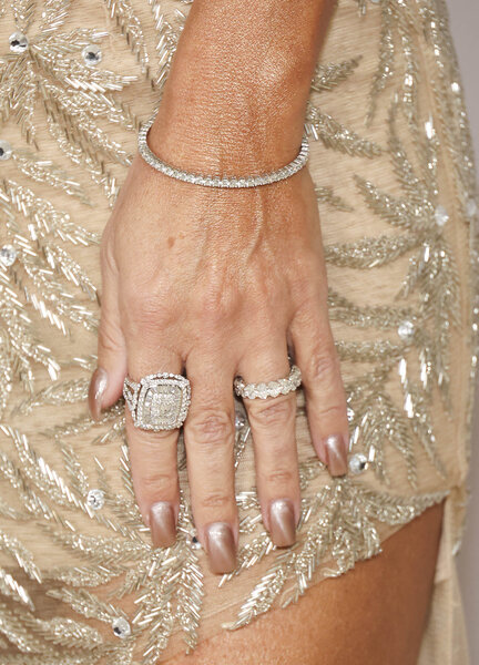 Teresa Giudice's jewelry details including diamond rings and a bracelet.