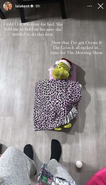 Lala Kent shows a Grinch stuffed toy on the floor with a small blanket over it.