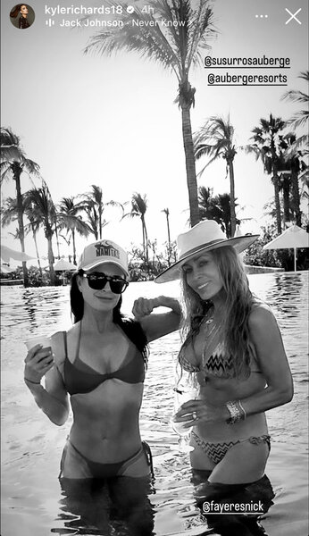 Kyle Richards in a pool with her friend Faye Resnick