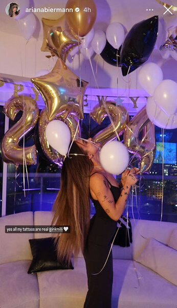 Ariana Biermann holding balloons at a New Years Eve party.