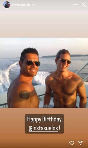 Andy Cohen and Mark Consuelos while on a boat together.