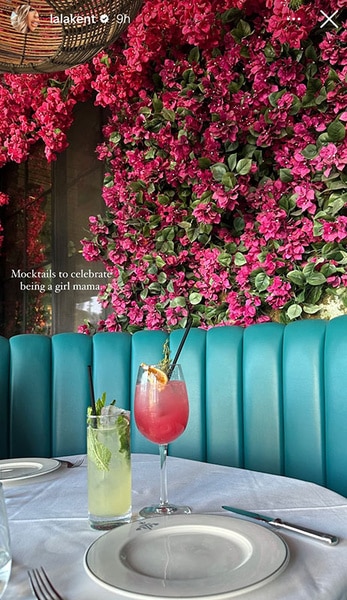Lala Kent's mocktails sitting on a table in front of seating and florals.